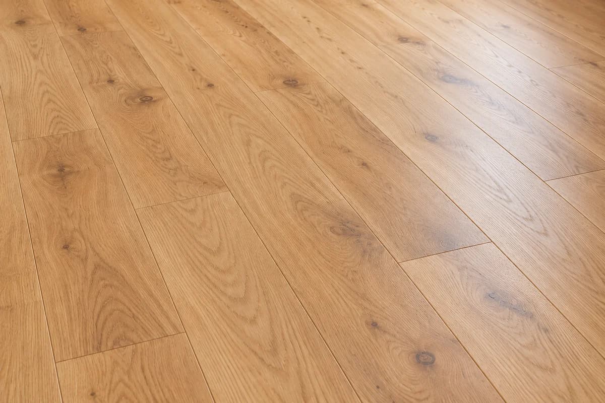 Close-up of natural oak hardwood boards with varied grain and small knots.
