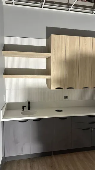 Opposite angle of the round-sink counter and ribbed backsplash